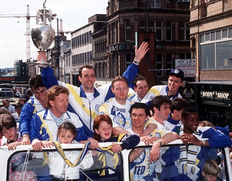 Gary McAllister salutes the supporters as the bus nears its destination at the City Art Gallery.